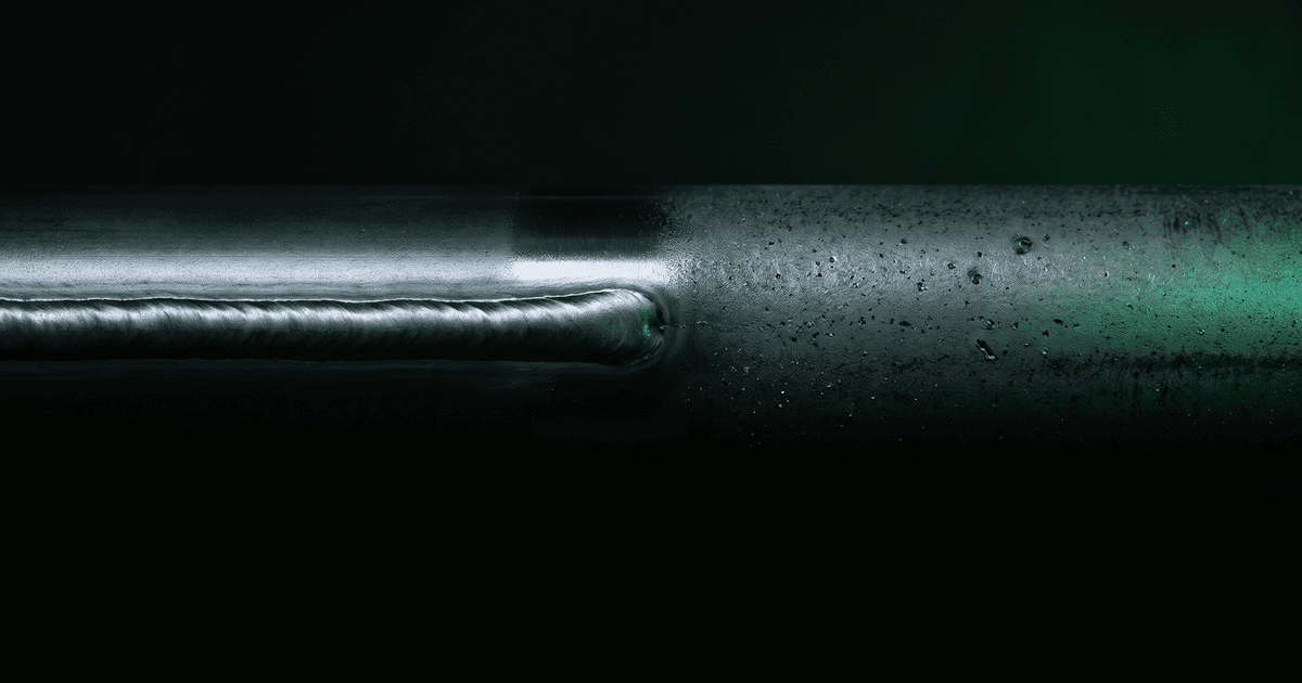 A finished weld crosses the piece and simply stops. Past it the same surface runs raw, and nothing marks where.